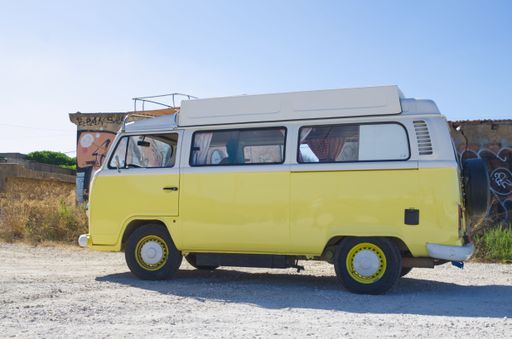 Luz, Lagos Portugal August 17 2022. T2 VW camper in bright yellow side view detail in full sun for rental