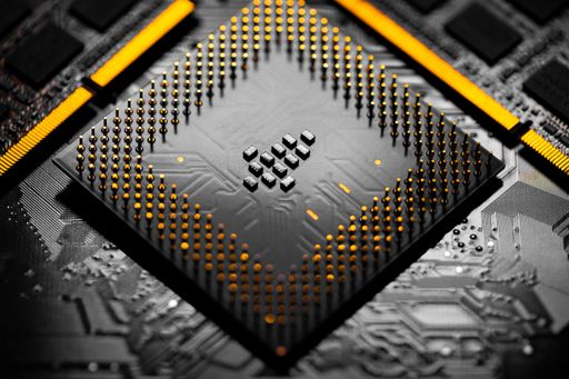 Macro Close up of RAM Memory and pins on Main CPU PC processor circuit board.	