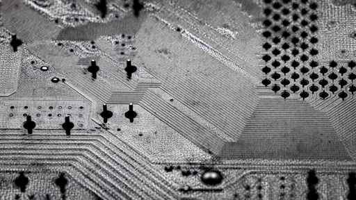Macro Close up of printed wiring and soldering on PC circuit board 