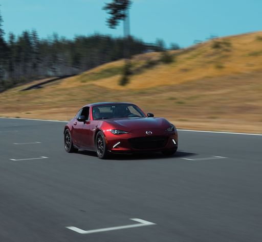 A red Mazda Mx5 on the racetrack