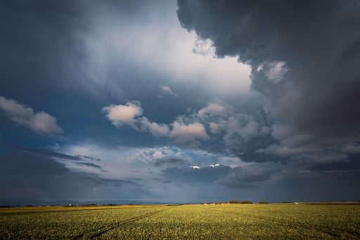 A mesmerizing view of scenic and cloudy sky above the field in Bavaria, Germany