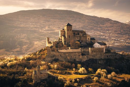 A beautiful shot of a sunset sky over Valere Basilica, in the city of Sion, Valais, Switzerland