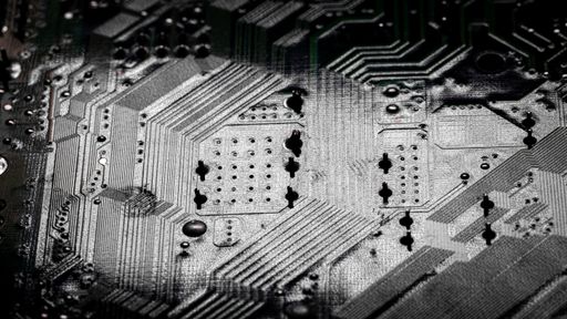 Macro Close up of printed wiring and soldering on PC circuit board 