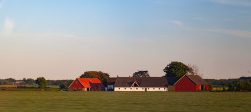 A daytime view of a typical farm with farmhouses nearby Helsingborg, Sweden