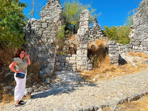 Scenic shot at the ruins of the medieval Templar castle at Allegre les fumades, Gard, France under a blue sunny sky