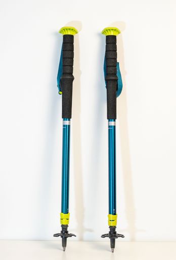 A vertical closeup of Trekking sticks isolated on a white background