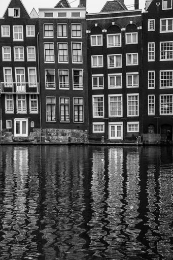 Reflection of Amsterdam's buildings in black and white