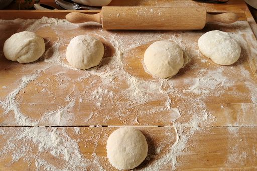 A closeup shot of dough balls for making pizza