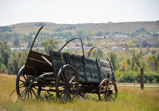 A scenic view of an old abandoned wooden cart found in the countryside