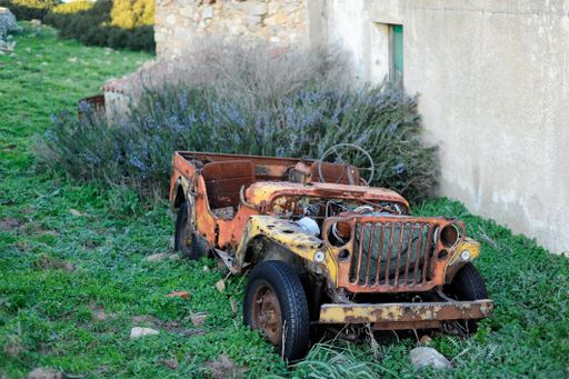 A closeup shot of an old rusty automobile