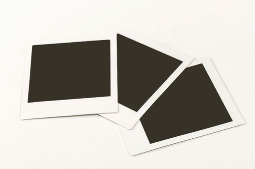 Three instant photos with copy space isolated on a white background