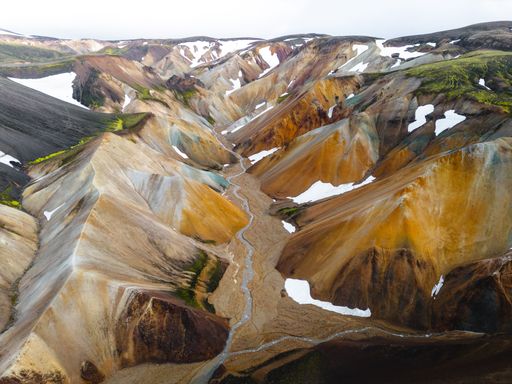 An aerial view of mountain peaks in the highlands of Iceland