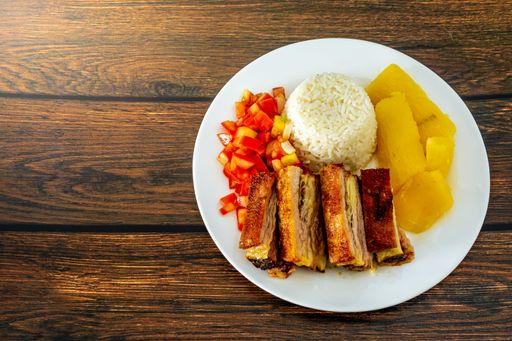 prato feito, a typical Brazilian food that comes with rice, cassava, salad and roasted ribs