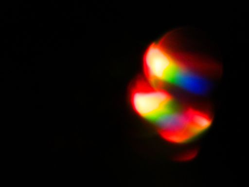 Rainbow light leaks and lens flares, beautiful design elements isolated on black backgrou