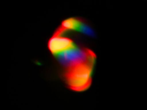 Rainbow light leaks and lens flares, beautiful design elements isolated on black backgrou