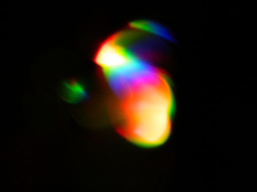 Rainbow light leaks and lens flares, beautiful design elements isolated on black backgrou