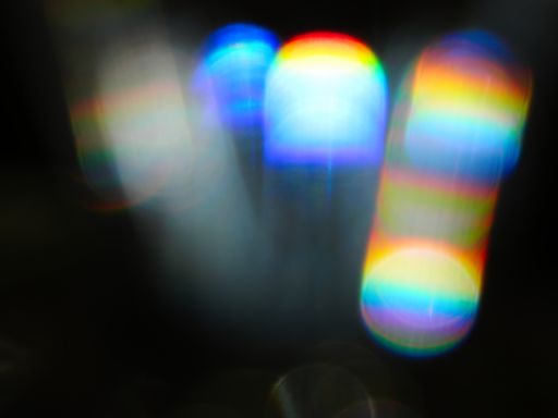 Rainbow light leaks and lens flares, beautiful design elements isolated on black backgrou
