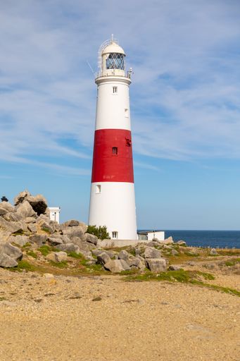 A vertical shot of a lighthouse on the coast in Portland
