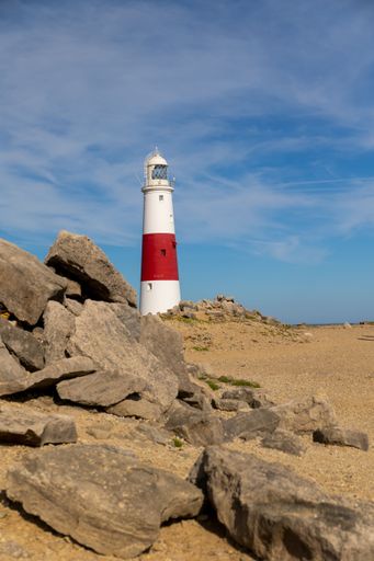 A vertical shot of a lighthouse on the coast in Portland