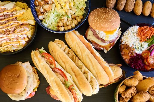 A finely set table with a huge range of delicious meals from saucy salads to juicy burgers and sandwiches