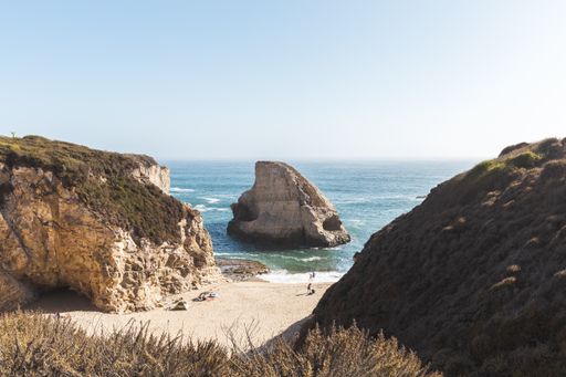 Big waves crashing on rock formations in Shark Fin Cove, California
