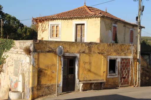 An old abandoned house in a village on a sunny day