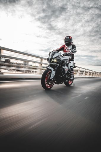 A rider riding a Yamaha MT-10 on the street