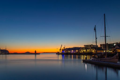 An aerial view of boats in port of Norway during sunset