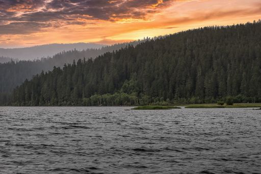 A mesmerizing view of a golden sunset over mountains