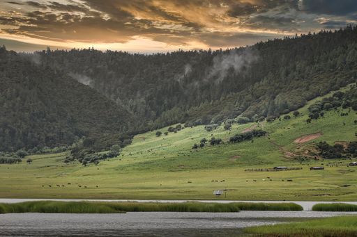 A mesmerizing view of a golden sunset over mountains