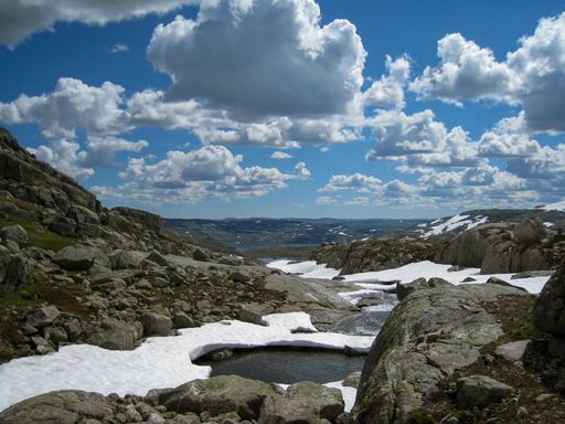 A beautiful shot of a snowy mountain under the cloudy sky