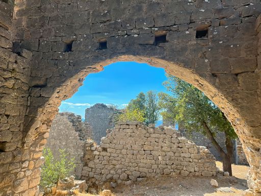 Scenic shot at the ruins of the old medieval Templar vestige, fortress at Allegre les fumades, Gard, France under a blue mediterranean sunny sky