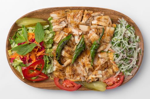 A top view of the chicken doner in a wooden plate