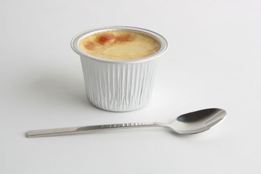 A close up shot of delicious egg flan in aluminum container