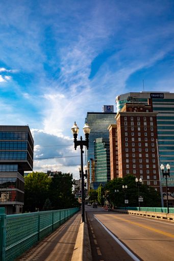 A vertical shot of city buildings as seen from the Gay Street Bridge in