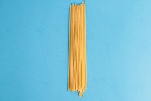 An overhead shot of raw spaghetti