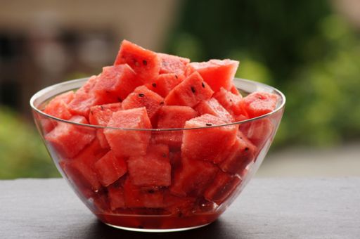 A closeup shot of fresh chopped watermelon in a bowl on the table