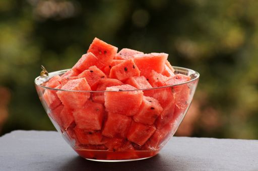 A closeup shot of fresh chopped watermelon in a bowl on the table