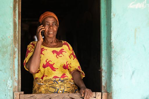 elderly african woman making a phone call