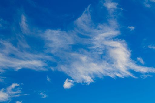 A scenic shot of a blue sky with clouds