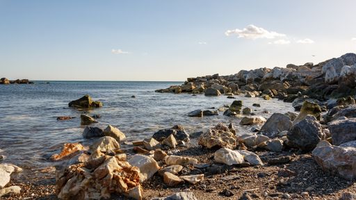 A beautiful shot of a beach with big rocks