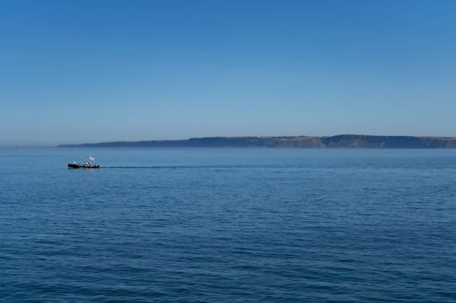 A fishing boat floating on the North Sea in Scarborough, North Yorkshire