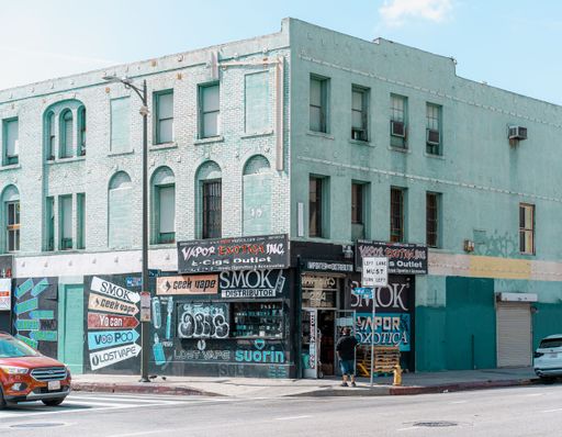 An old building with small markets and colorful posters in Los Angeles, CA, USA