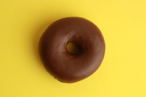 A top view of the sweet chocolate doughnut