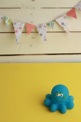 A closeup shot of a toy blue octopus bathtub