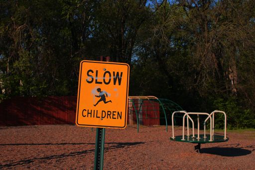 A slow children safety sign in a park