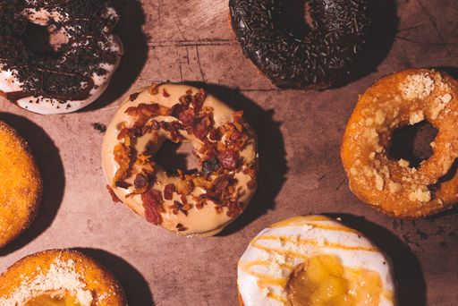 A top view of fall-themed delicious donuts - concept of sweets