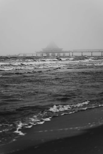 Minimalistic Black And White Photo Of The Ocean And The Famous Pier Of Heringsdorf
