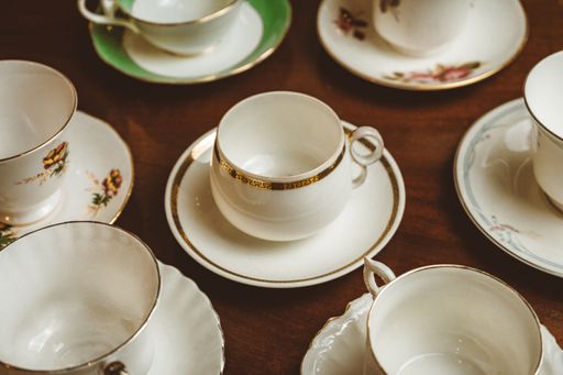 A closeup shot of cups of tea on a wooden table