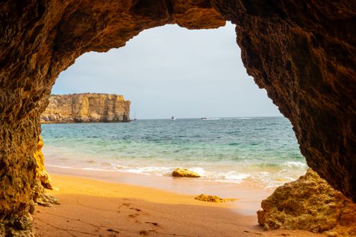A natural cave in the Algarve on the beach at Praia da Coelha, Albufeira, Portugal